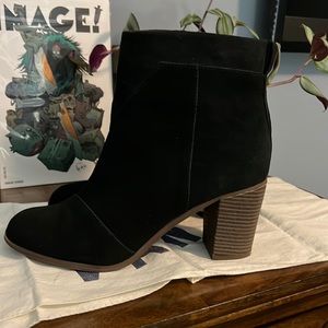 Pair of black Tom’s womens boots size 10.